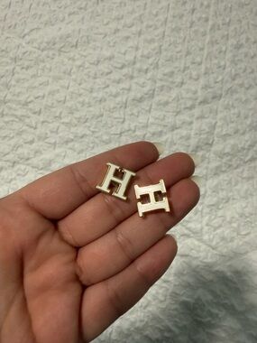 Hermes’ white enamel H earrings